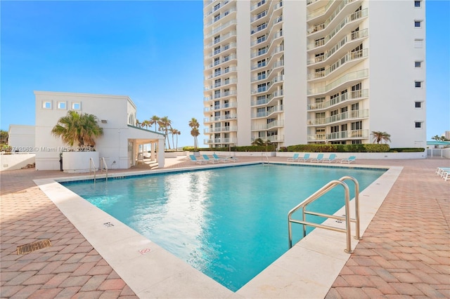 view of swimming pool featuring a patio