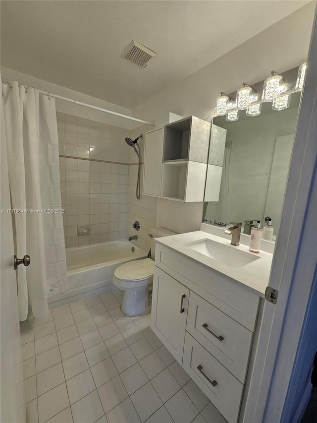 full bathroom featuring toilet, shower / bath combo, vanity, and tile patterned floors