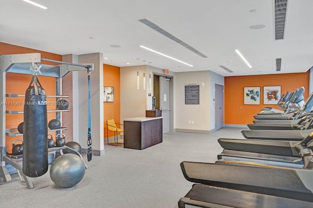 workout area with light colored carpet