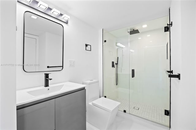 bathroom with vanity, an enclosed shower, and toilet