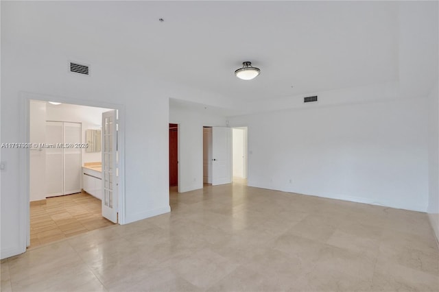 unfurnished room featuring light tile patterned flooring