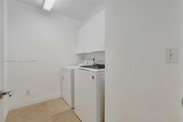 laundry room with cabinets and independent washer and dryer