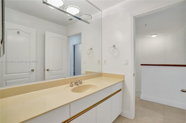 bathroom featuring tile patterned flooring and vanity