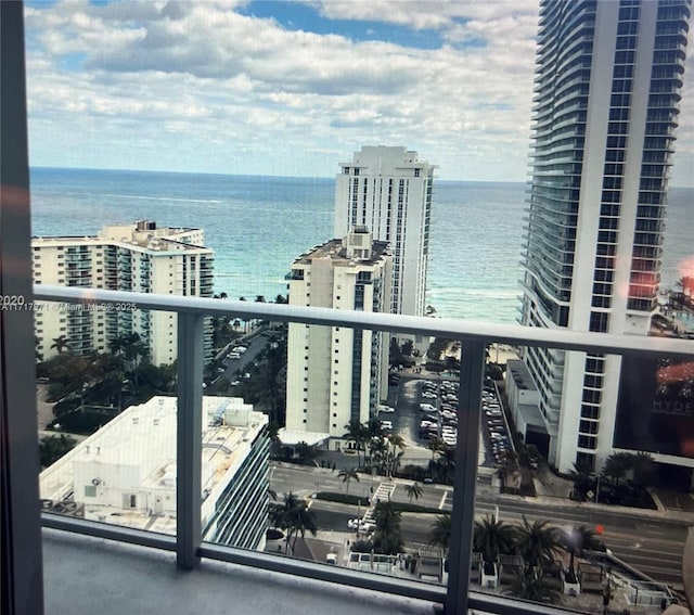 balcony featuring a water view