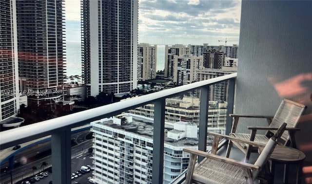 balcony featuring a water view