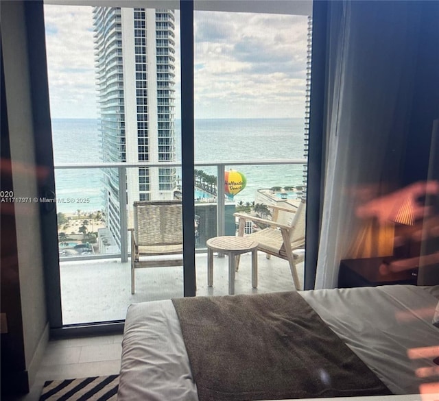 bedroom featuring a water view