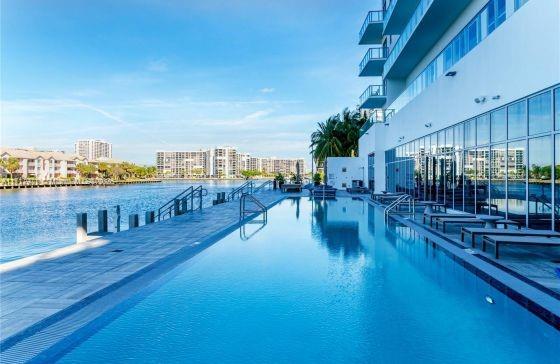 view of pool featuring a water view