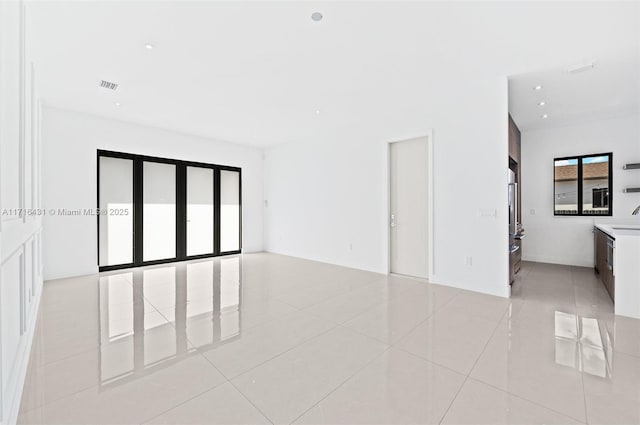 empty room featuring light tile patterned floors