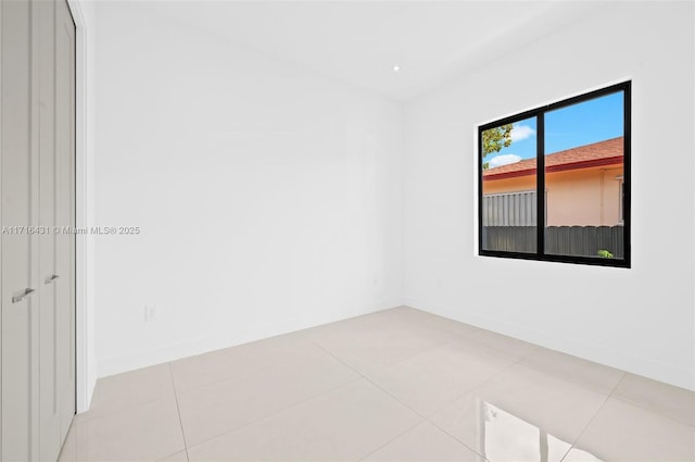 empty room featuring light tile patterned floors