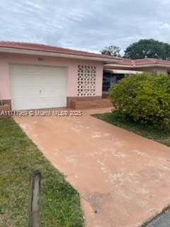 exterior space with a garage