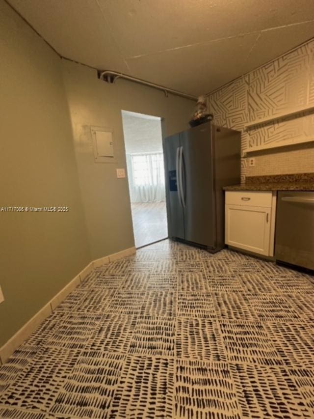 kitchen with white cabinetry and stainless steel appliances