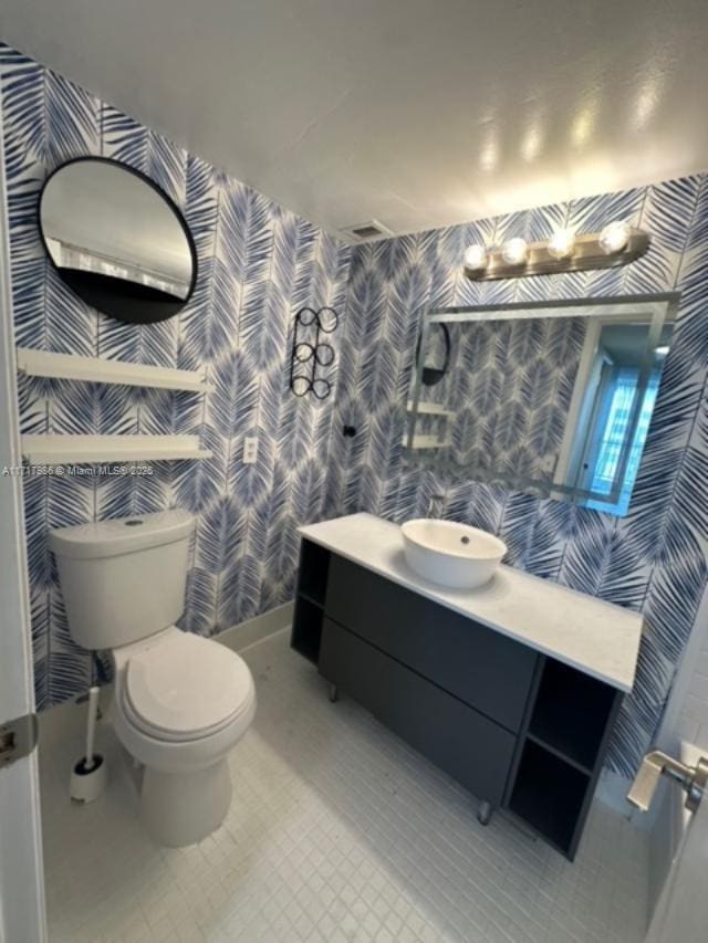 bathroom with vanity and toilet