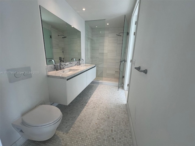 bathroom featuring tile patterned flooring, vanity, toilet, and a shower with door