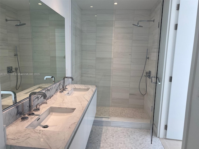 bathroom featuring vanity, tile patterned floors, and a shower with door