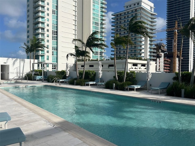 view of swimming pool featuring a patio area