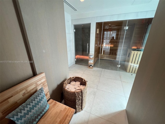 corridor featuring light tile patterned floors