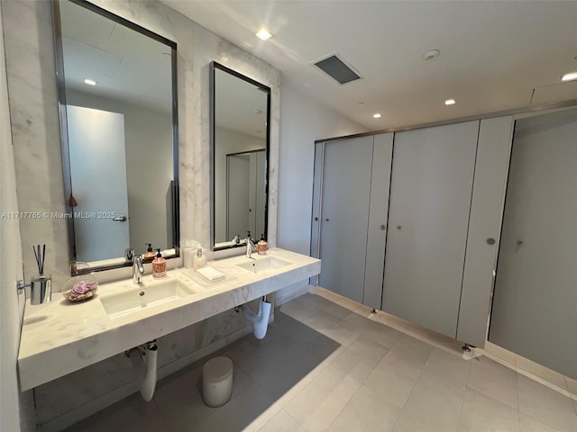 bathroom with tile patterned floors and sink