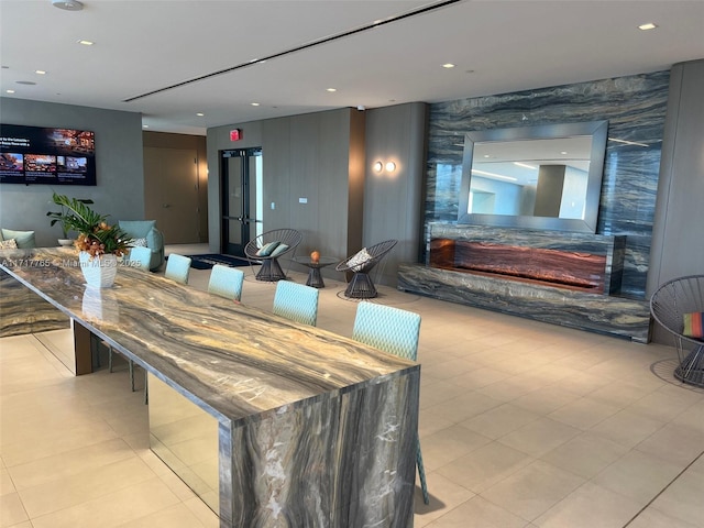 700 NE 26th Ter Unit 2004, Miami, FL 33137 - dining room featuring light tile patterned floors, recessed lighting, and a fireplace