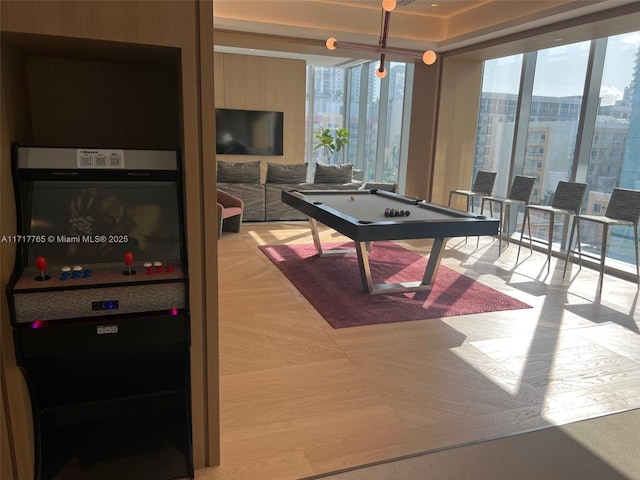 rec room with floor to ceiling windows and pool table