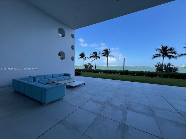 view of patio / terrace with outdoor lounge area and a water view