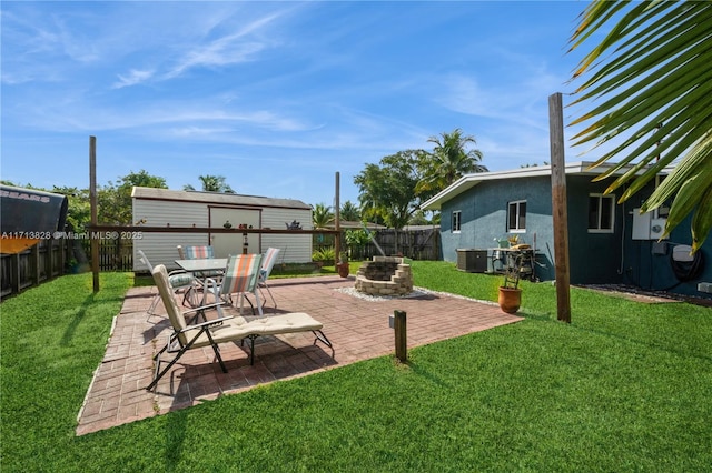 view of yard featuring a patio area and central air condition unit