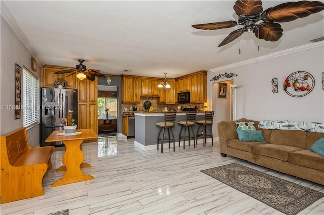 living room featuring crown molding and ceiling fan