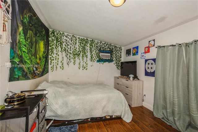 bedroom featuring dark wood-type flooring