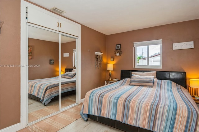 carpeted bedroom with a closet