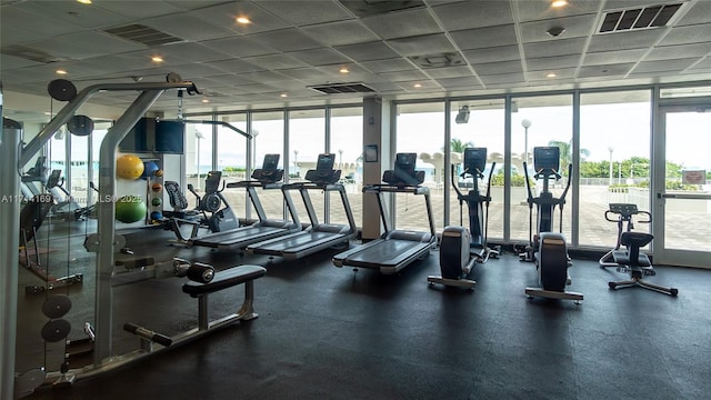 exercise room with expansive windows and plenty of natural light