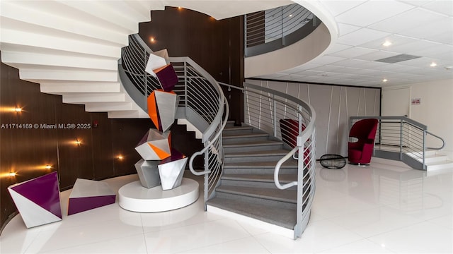 staircase with tile patterned floors