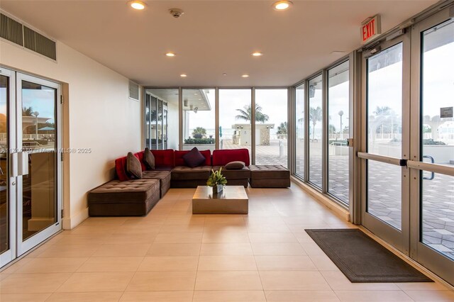 sunroom featuring french doors