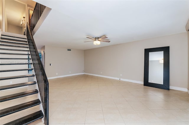 unfurnished room with ceiling fan