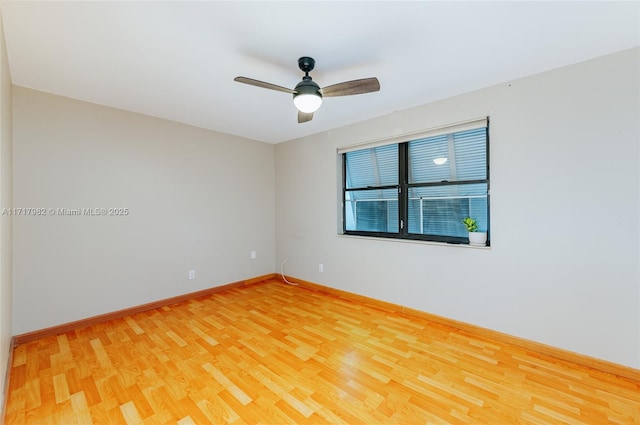 empty room featuring wood-type flooring and ceiling fan