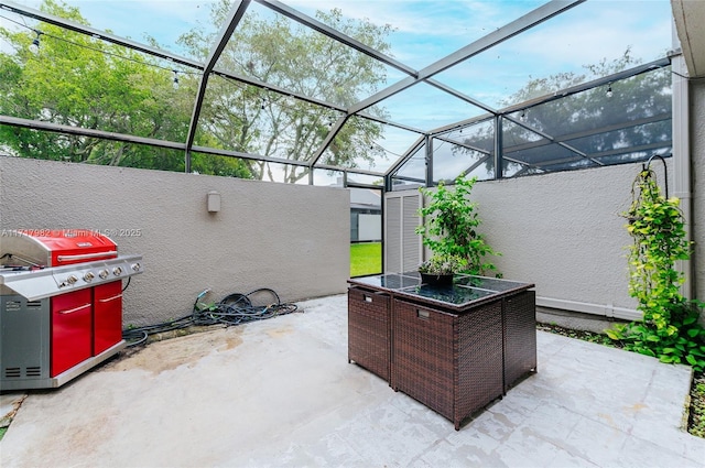 view of patio / terrace with a lanai