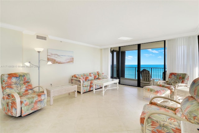 living room featuring light tile patterned flooring, a water view, a wall of windows, and crown molding