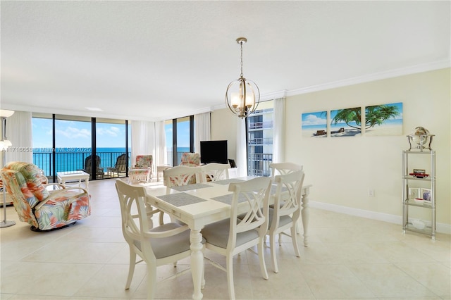 tiled dining area featuring a notable chandelier, expansive windows, and ornamental molding