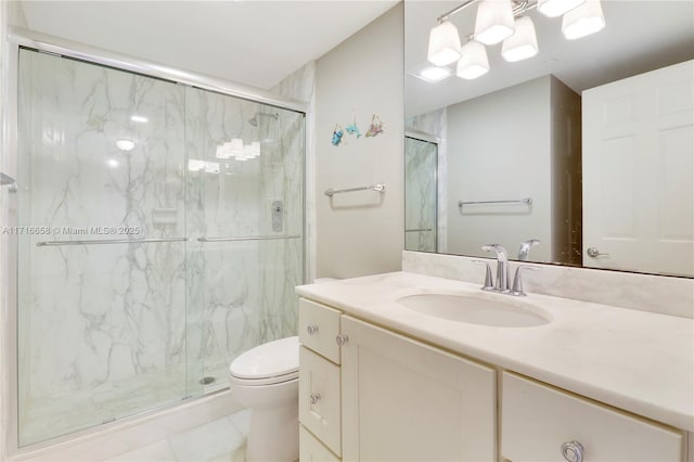 bathroom with tile patterned flooring, vanity, toilet, and walk in shower