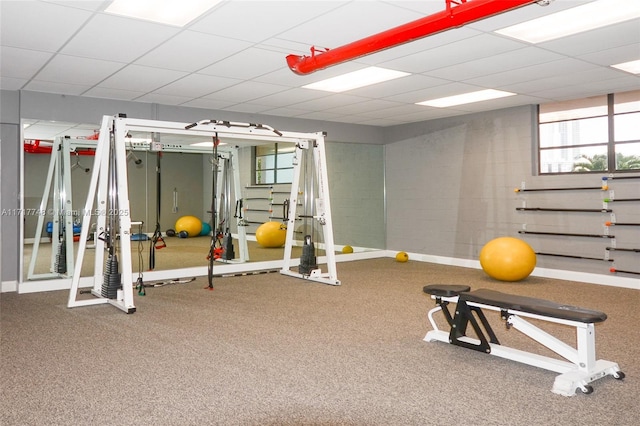 exercise room featuring a drop ceiling