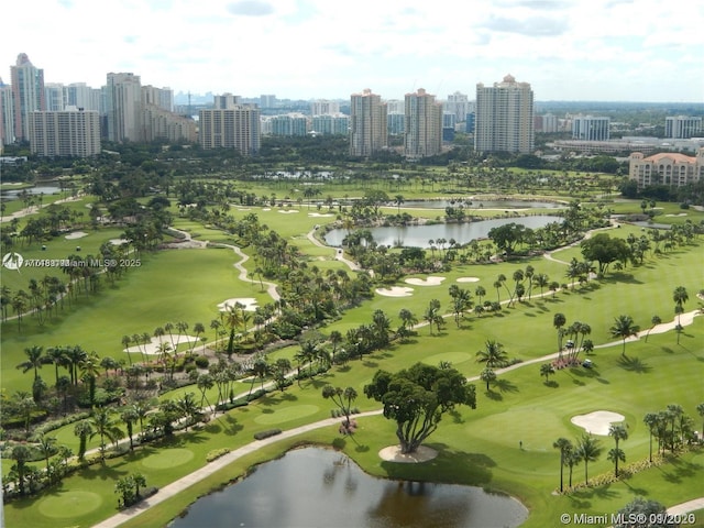 birds eye view of property featuring a water view, a view of city, and golf course view