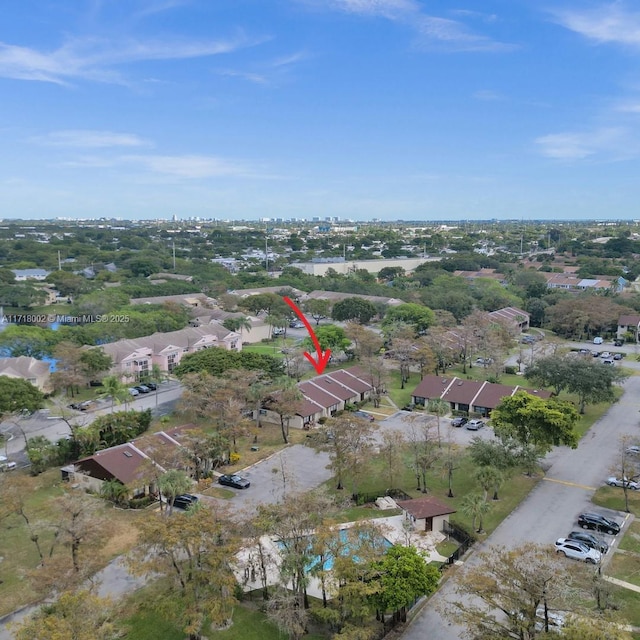 birds eye view of property with a residential view