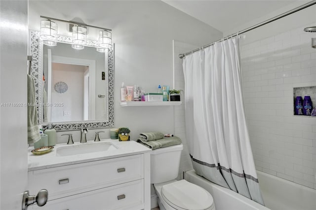 full bathroom featuring vanity, toilet, and shower / tub combo with curtain