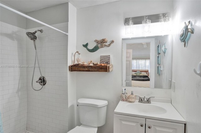 bedroom with ceiling fan, light hardwood / wood-style floors, and ensuite bath