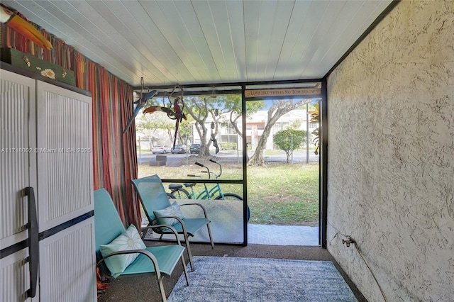 sunroom / solarium with wood ceiling