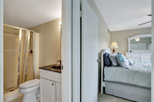 carpeted bedroom featuring a textured ceiling