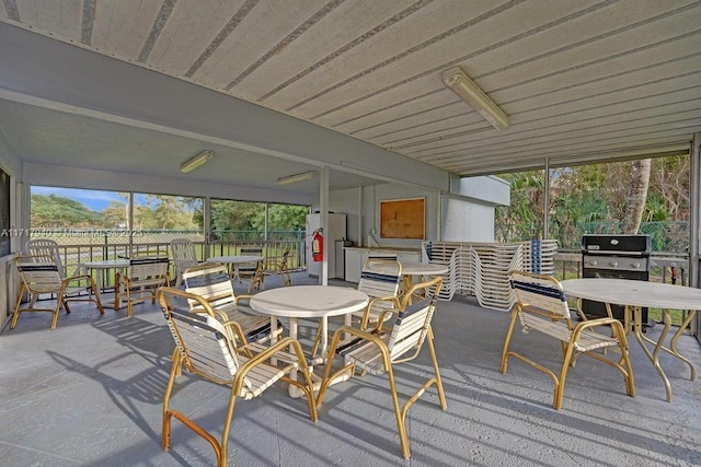 1402 NW 80th Ave Unit 410, Margate, FL 33063 - wooden terrace with outdoor dining space and area for grilling