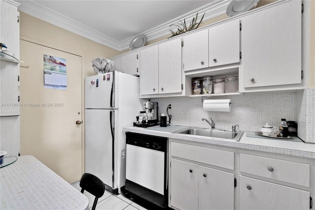 kitchen featuring decorative backsplash, sink, crown molding, white appliances, and white cabinetry