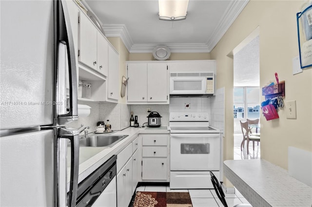 kitchen featuring crown molding, backsplash, white appliances, and white cabinets