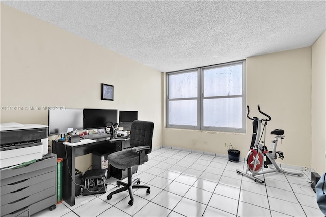 tiled office featuring a textured ceiling