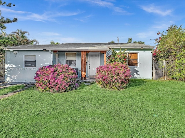 ranch-style home with a front yard