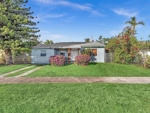 single story home featuring a front yard